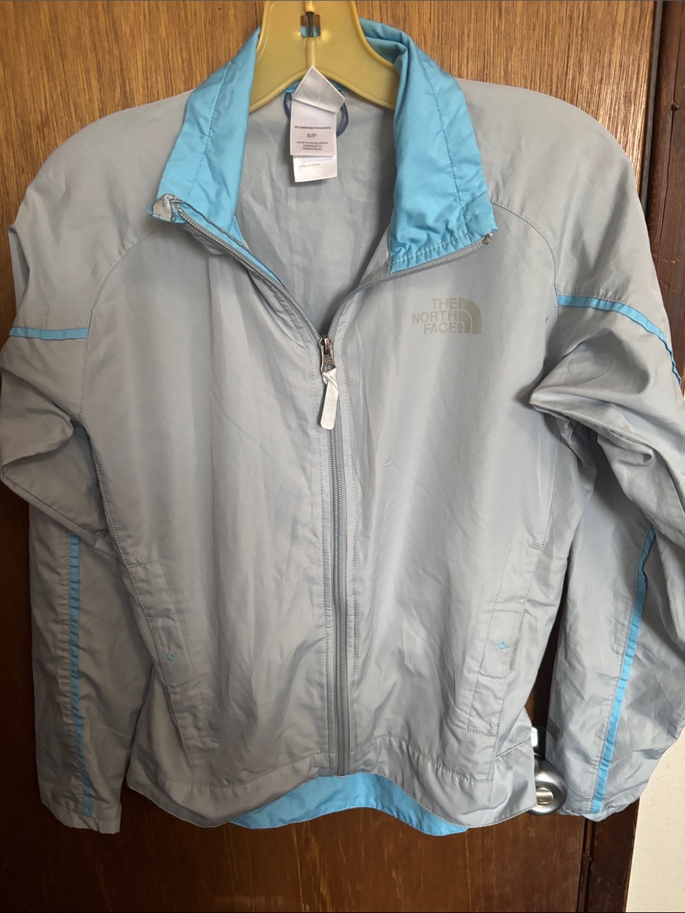 The North Face Women's Light Gray Jacket with Blue Trim